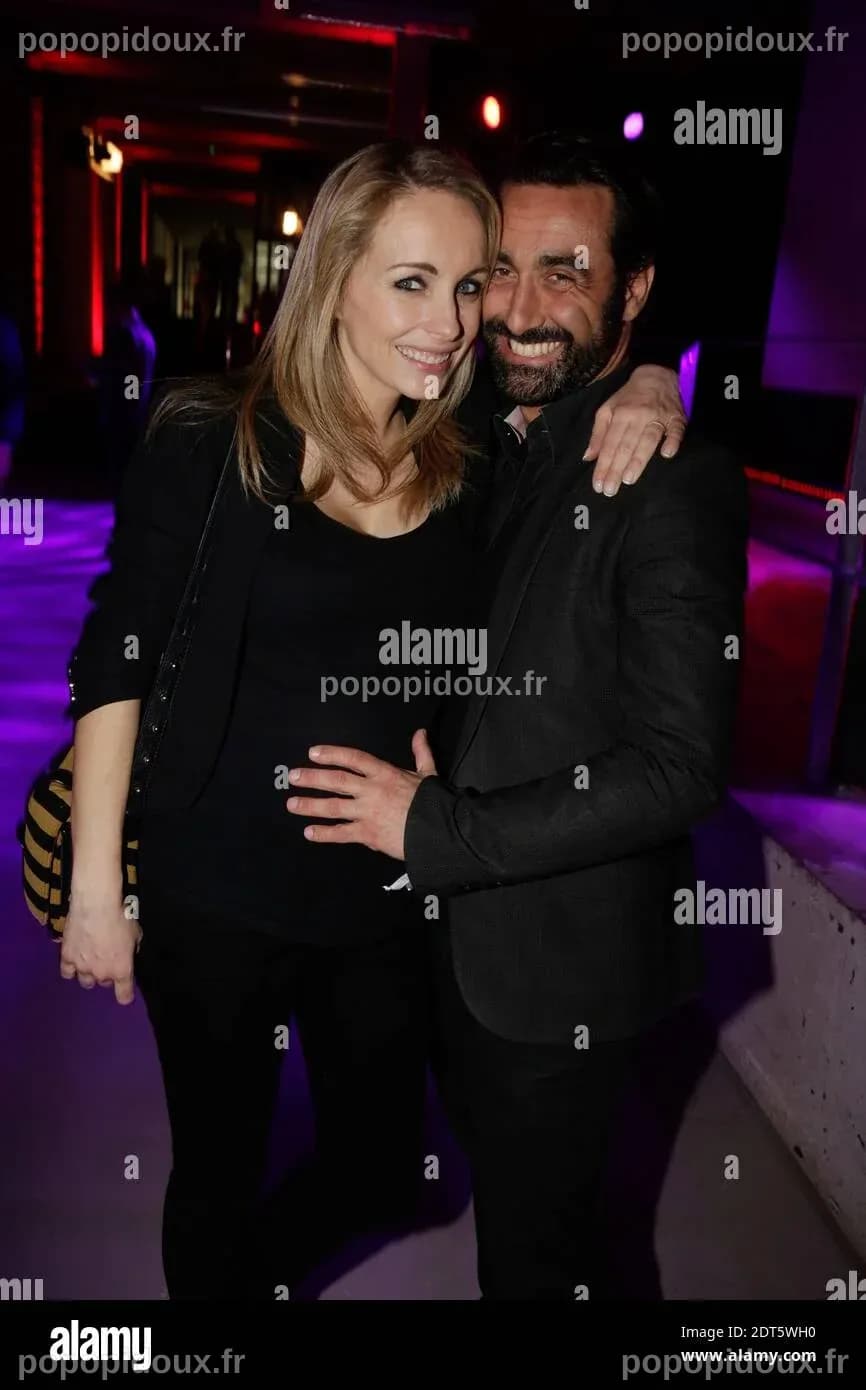 Olivier Benkemoun et sa femme Anne Denis (enceinte) assistent à la fête ...