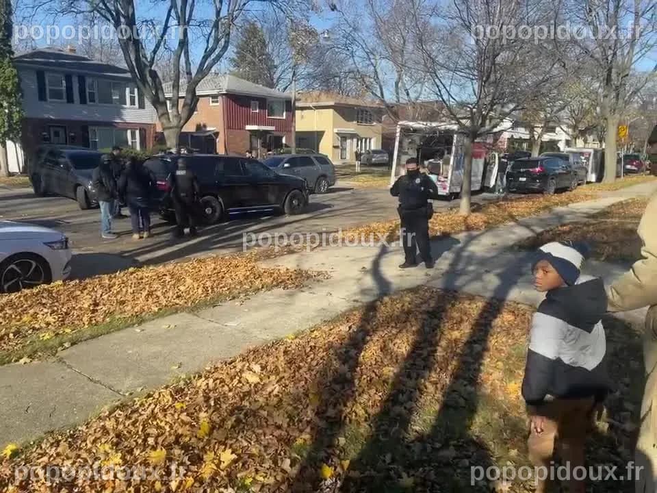 Neighbors look on after chase with UHaul ends in crash